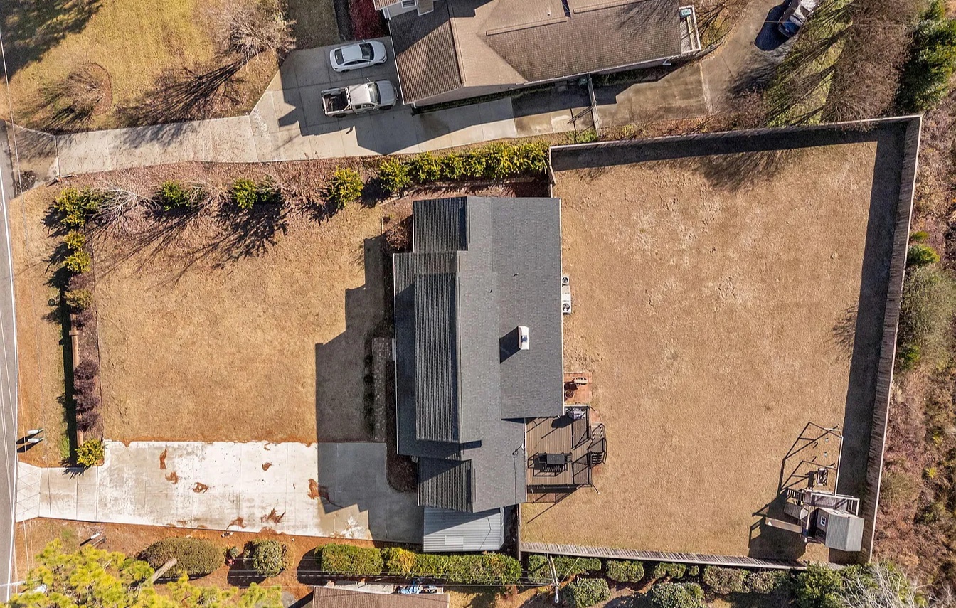 Golden Dune Getaway aerial view before the renovation: bare backyard